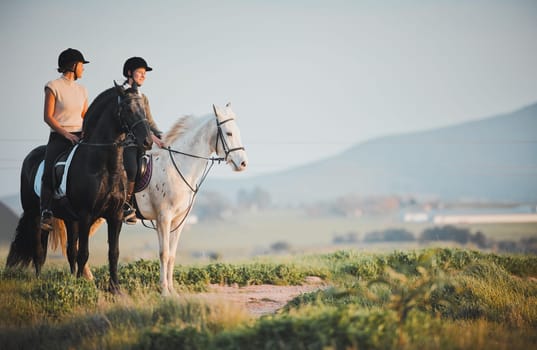 Horse riding, freedom and view with friends in nature on horseback enjoying their hobby during a summer morning. Countryside, equestrian and female riders outdoor together for adventure or bonding.