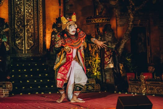 Balinese artist dancing with show mask