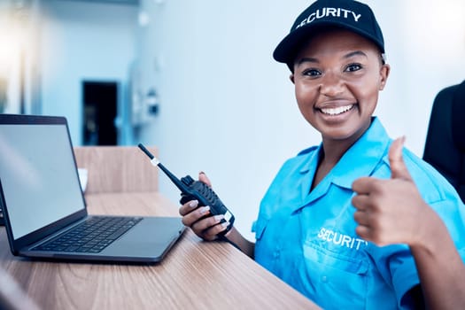 Security guard, thumbs up and police use a walkie talkie or radio for an emergency or criminal investigation. Protection, safety and officer talking in a law enforcement service office for crime