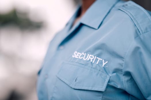 Uniform, security guard and in closeup for protection from crime with worker for safety in mock up background. Duty, service and bodyguard with uniform for patrol or defence for career at agency.