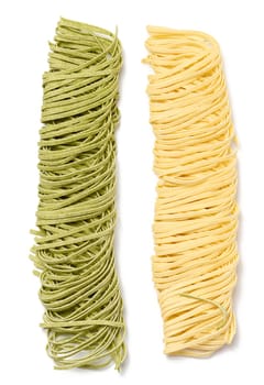 Raw spinach and egg noodles on white background, top view