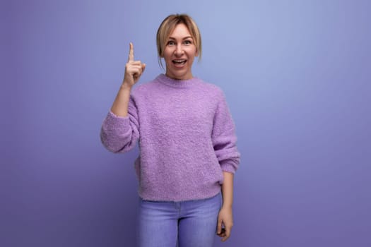 charming cute blondie woman in lavender sweater with brilliant idea on purple background with copy space