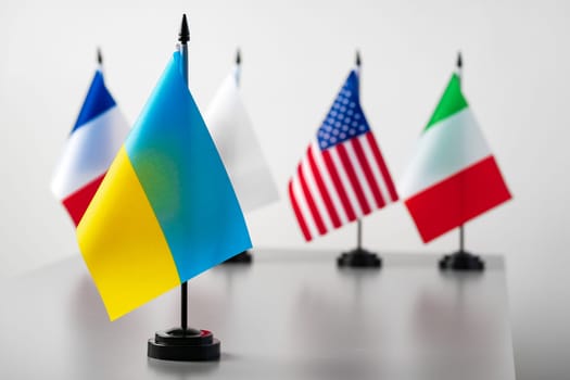 Small country flags standing at a table