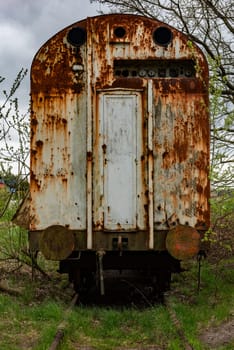 Old rusty freight carriage wagon on railway siding