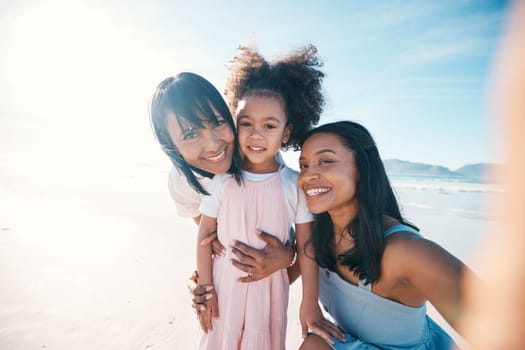 Selfie of mother, daughter and grandmother on the beach together during summer for vacation or bonding. Portrait, family or children and a little girl in nature with her parent and senior grandparent