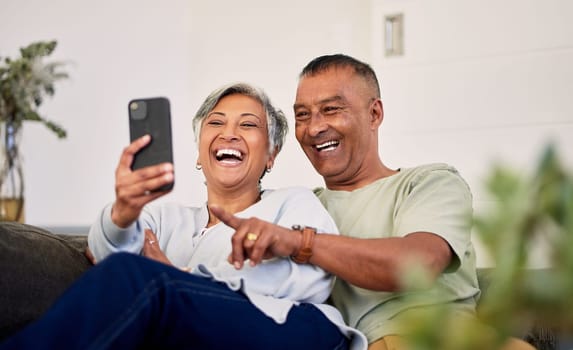 Love, phone and senior couple laughing at funny social media meme, online comic or streaming comedy video. Smartphone application, marriage humour and elderly people laugh at retirement joke at home