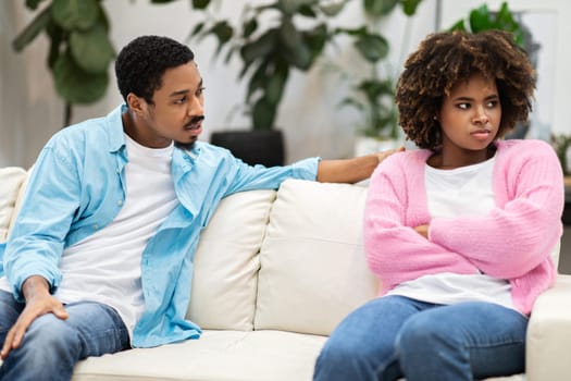 Couple having argument on the couch at home