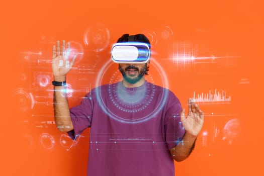 Young man using virtual reality headset, touching hologram