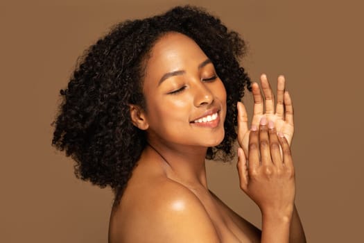 Sensual topless gorgeous pretty black woman on brown background