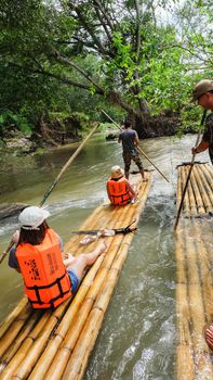 CHIANG MAI, THAILAND - JULY 18: Tourists are rafting trips in the creek with bamboo float rafting on July 18,2016 in Chiangmai Thailand -Northern Thailand
