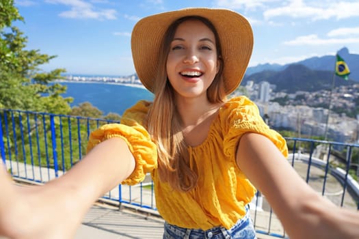 Tourism in Brazil. Fashion tourist woman takes selfie photo in Rio de Janeiro, Brazil. 