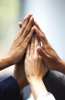 High five, success and hands of employees for team building, meeting or collaboration. Unity, diversity and closeup of group of business people in celebration of goals, achievement or teamwork.