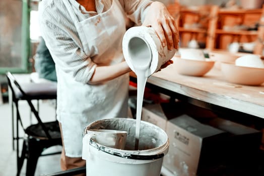 I work with all kinds of clay. Cropped shot of an unrecognizable artisan working in a pottery workshop.