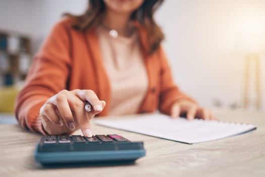 Finance, woman and hands at calculator for budget, taxes report and accounting documents at home. Closeup of person, notes and planning savings, investment money or administration for financial bills