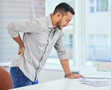 Back pain, man and office worker with muscle injury and accident from stress and burnout. Hurt, medical issue and male employee with spine inflammation and anxiety from bruise at work feeling tired