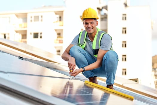 Clean energy, solar panels and portrait of man on roof for installation, sustainable business and electricity. Engineer, sustainability and photovoltaic power on city rooftop with renewable resource.