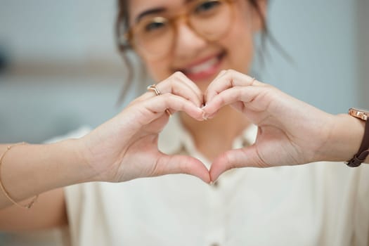 Heart, love and happy with hand of woman for thank you, support and peace. Kindness, hope and motivation symbol with closeup of female person and sign at home for emoji, care and romance icon