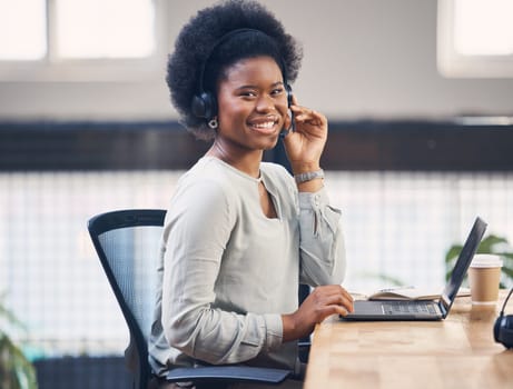Portrait, call center and laptop with a black woman consultant working in her telesales office. Contact us, customer service and telemarketing with a female employee consulting using a headset