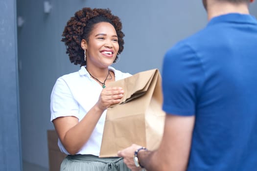 Happy woman, package and delivery man by door for order, fast food or parcel in ecommerce at home. Female person or customer receiving paper bag, cargo or collection from courier guy by entrance