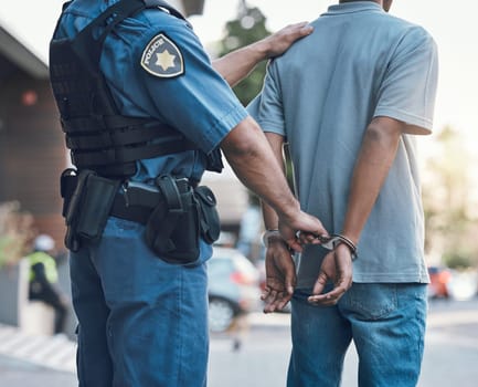 Stop, handcuffs and hands of police man with criminal in city for justice, crime or corruption. Illegal, arrest and law enforcement officer with suspect, thief or gangster for jail, robbery or fail