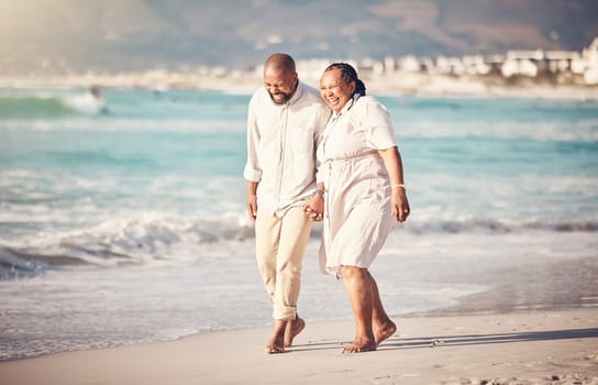 Love, hand holding and senior with black couple at beach and laugh on retirement, vacation and summer break. Travel, smile and and bonding with man and woman walking for happy, funny and relax