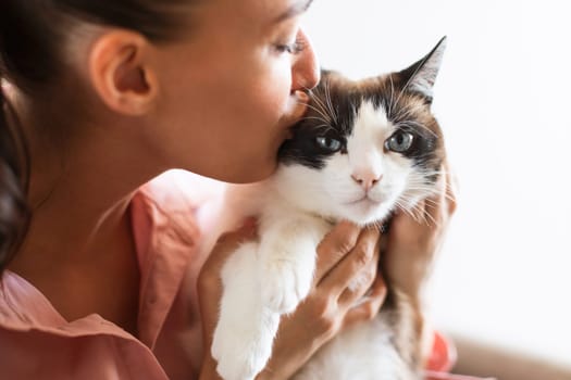 Cat Owner Lady Kissing Her Lovely Fluffy Friend Indoors, Closeup