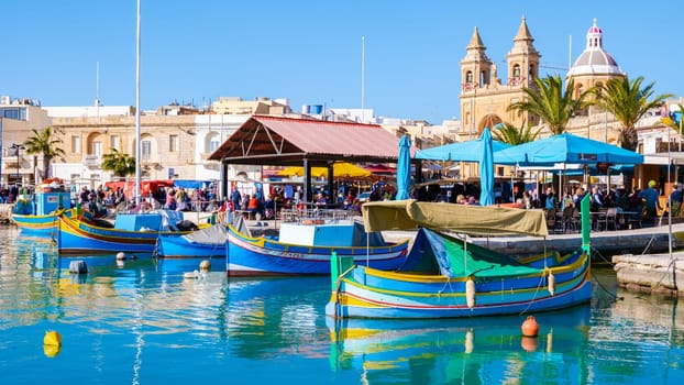 Malta December 2017, Marsaxlokk harbor fishing boats colorful Malta on a sunny day in winter