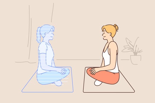 Woman doing yoga with hologram virtual trainer sitting on fitness mat in lotus position