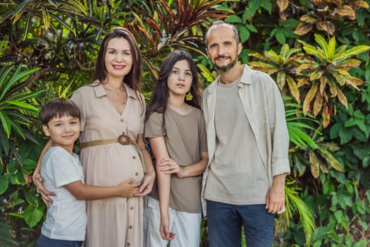 A loving family enjoying a leisurely walk in the park - a radiant pregnant woman after 40, embraced by her husband, and accompanied by their adult teenage children, savoring precious moments together amidst nature's beauty. Pregnancy after 40 concept