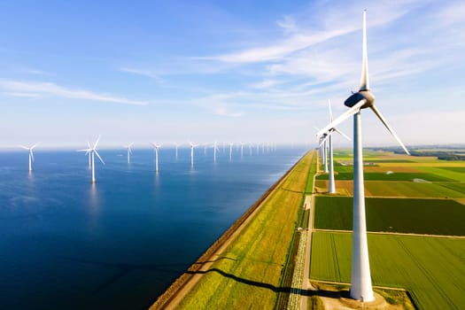 windmill park in the ocean aerial view with wind turbine Flevoland Netherlands Ijsselmeer