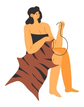 Prehistoric woman sewing leather and fur clothes