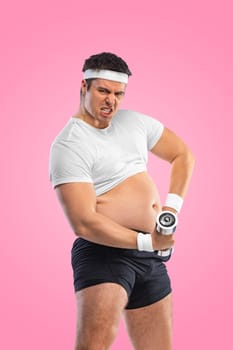 A funny fat man with dubbell isolated on pink background. Obesity and eating disorder. Concept for dietetics and fitness advertising in social networks.