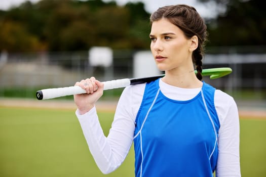 Field hockey woman, thinking and sport with vision, ideas and goals for career, competition and stick for game. Girl, athlete and outdoor for training, workout or exercise with strategy for contest