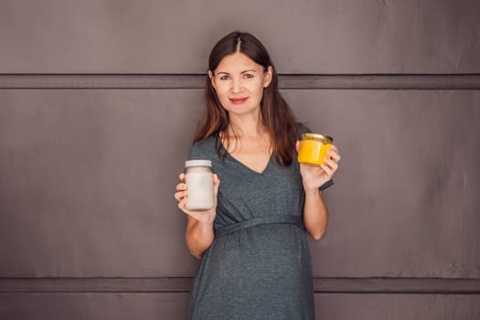 A glowing pregnant woman over 40, savoring nourishing ghee and coconut oil for a healthy and vibrant pregnancy journey