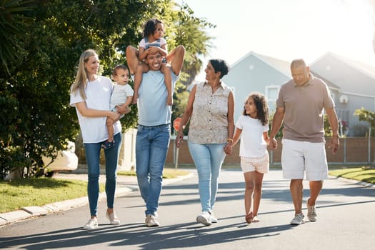 Outdoor, big family and walking in neighbourhood street together for fun, bonding or activity with kids, parents and grandparents. Happy, time and relax in urban summer with children on vacation