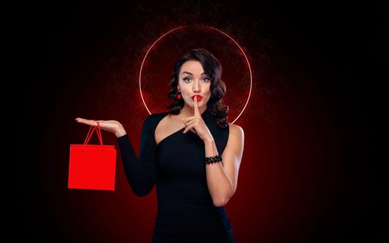 Black friday sale concept for your stor. Shopping girl holding red bag isolated on dark background. Blackfriday holiday. Download high resolution template for the poster.