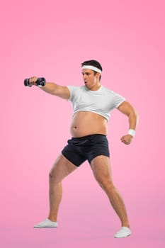 A funny fat man with dubbell isolated on pink background. Obesity and eating disorder. Concept for dietetics and fitness advertising in social networks.