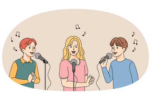 Happy children singing in microphones