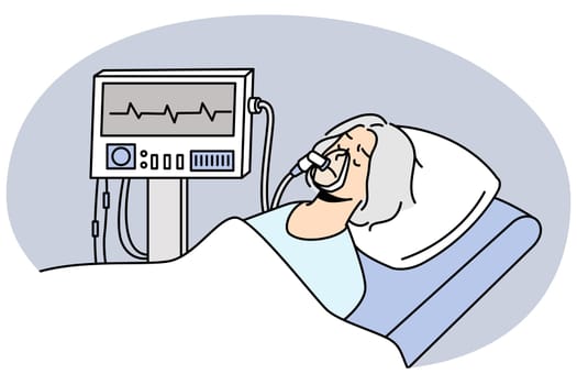 Mature woman breathing with ventilating machine