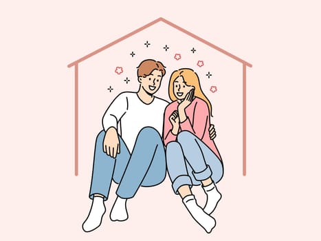 Happy couple sits in imaginary house dreaming of mortgage and buying own property