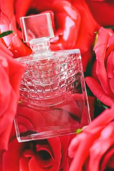 Spring floral scent, perfume bottle in roses, perfumery as luxury gift, beauty flatlay background and cosmetic product ad