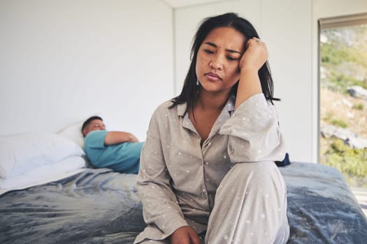 Frustrated couple, argument and fight in conflict on bed after disagreement, cheating or affair. Upset or unhappy woman and man in divorce, depression or toxic relationship and breakup in the bedroom