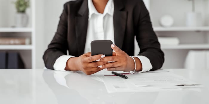 Communication in business. Cropped of black businesswoman using cellphone, sitting in office, panorama