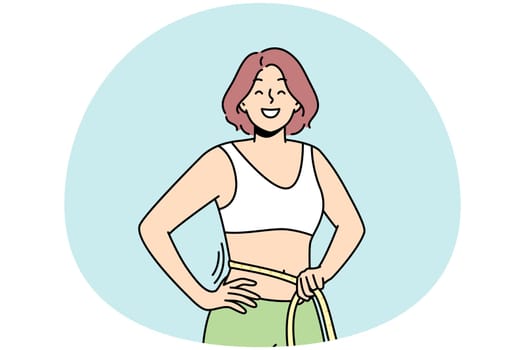 Smiling woman with tape on waist