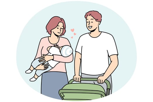 Happy parents with infant walking outside