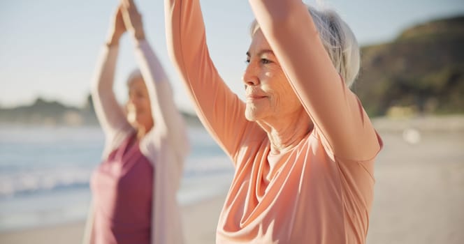 Yoga, meditation and senior women, stretching and fitness on beach for wellness, exercise and pilates training. Zen, friends and old people for muscle health, mindfulness and relax in nature and sea