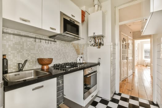 a kitchen with black and white checkered floors