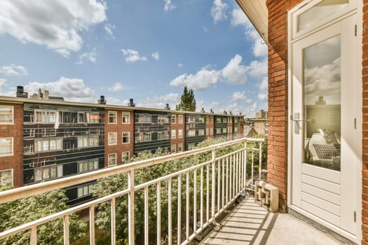 a balcony with a view of a brick apartment building