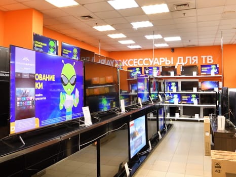 Moscow, Russia - Oct 19. 2023. TVs and and others in DNS network store selling household appliances in Zelenograd