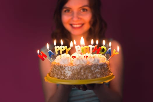 attractive teenage girl celebrating her birthday with cake